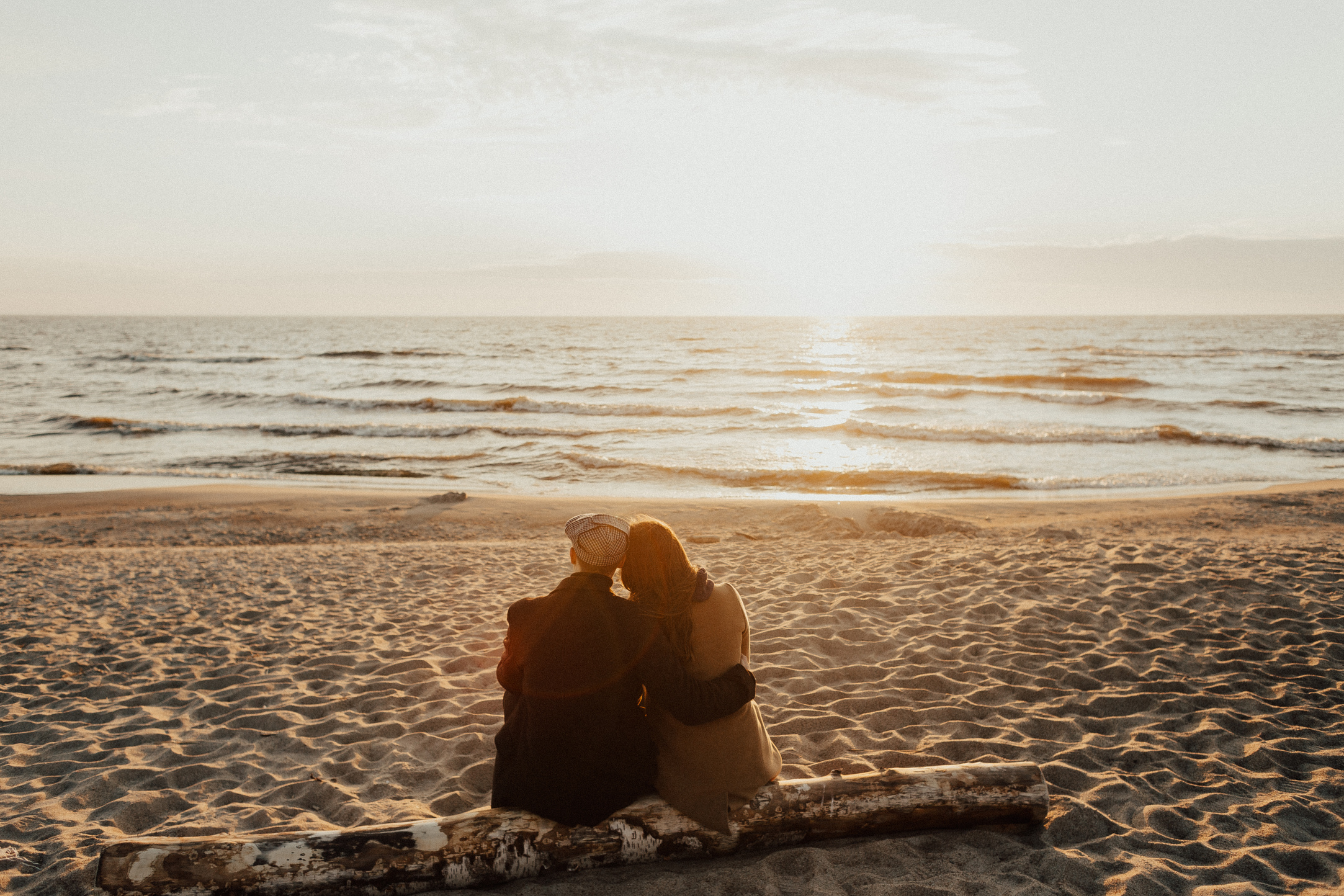 A Couple Sitting on a Beach